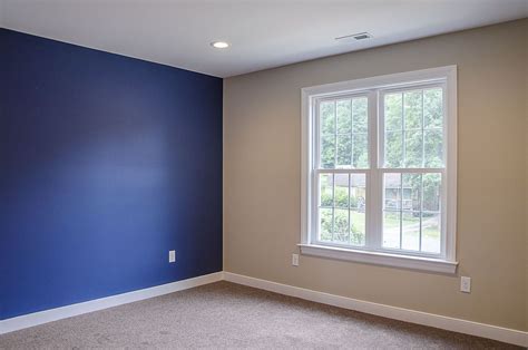 Master suite with blue royal blue accent wall ©Balducci Builders Blue ...