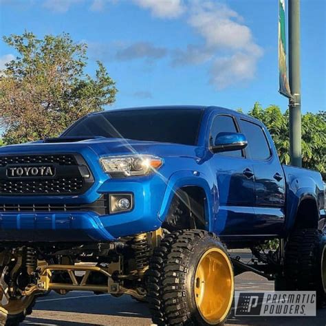 Lifted Toyota Tacoma Truck, Powder Coated Rims In Transparent Gold ...