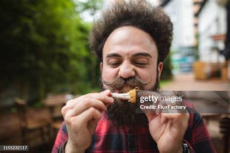 Guy Eating Chicken Wings Photos and Premium High Res Pictures - Getty ...