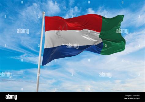 flag of Dutch Creole peoples Griqua people at cloudy sky background ...