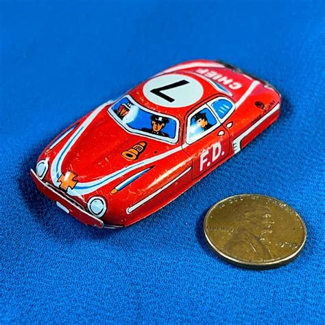 VINTAGE TIN TOY FIRE CHIEF CAR | EstateSales.org