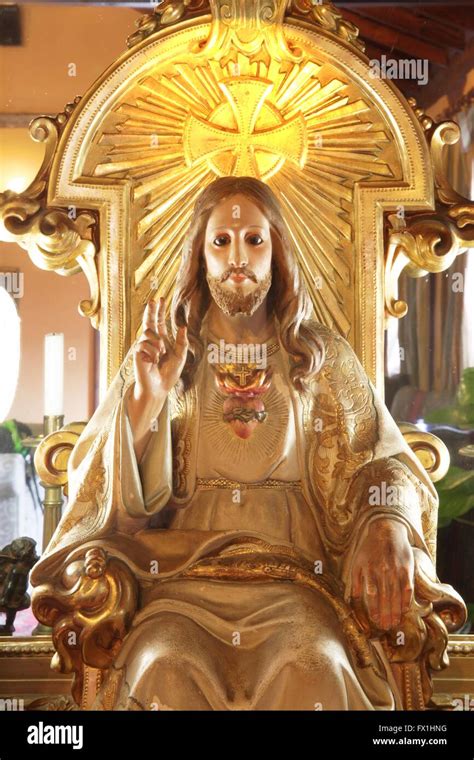 Jesus Christ effigy sitting on a throne Stock Photo - Alamy