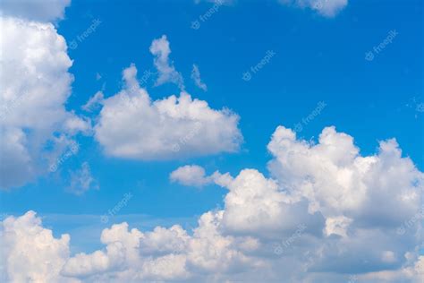 Premium Photo | Beautiful white clouds on a bright blue background