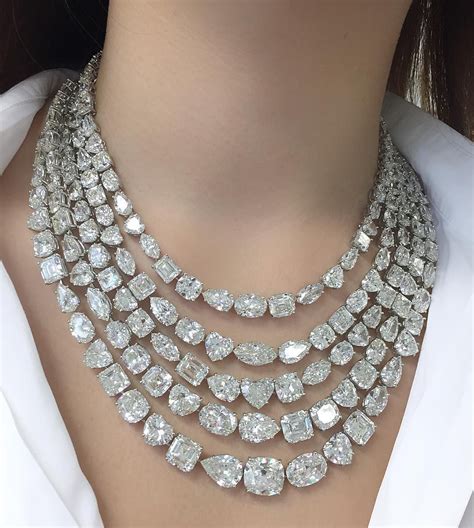 Trying on a necklace composed of 176 diamonds with a total weight of ...