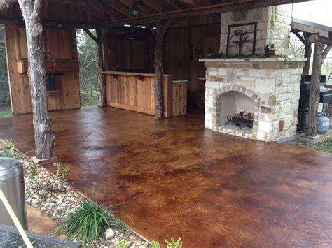 Outdoor Patio With Fireplace And Stained Concrete By Bryan Brenham