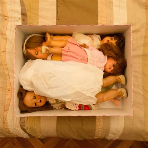 Central Open Box On A Bed Full With Collectible Vintage Dolls With Warm