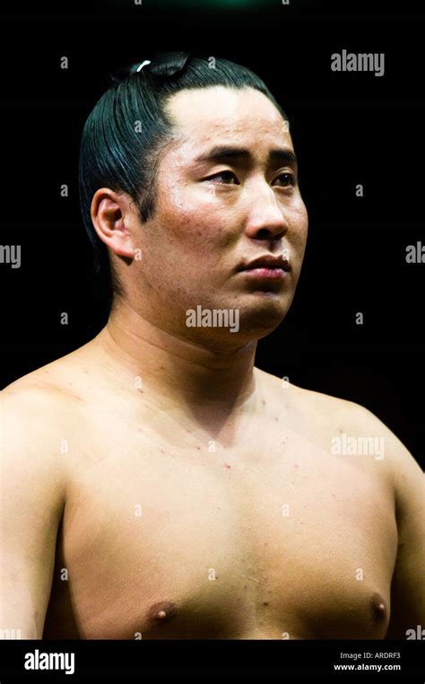 A Sumo Wrestler Prepares For His Bout At The Ryogoku Stadium In Tokyo