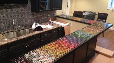 Mounted on industrial steel bar. Build an awesome custom bottle cap bar top | Your Projects@OBN