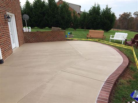 Stained Concrete Patio With A Sprayed Concrete Brick Border In Goode