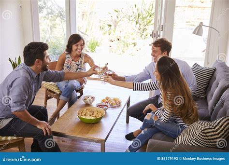 Couple Entertaining Friends At Home Stock Image Image Of Drink Asian