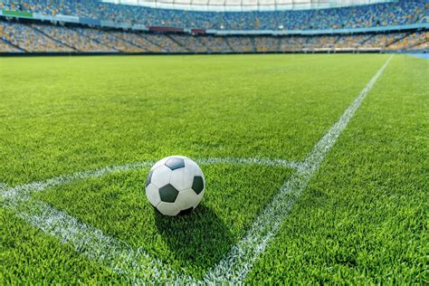 Soccer Ball On Grass In Corner Kick Position On Soccer Field Stadium