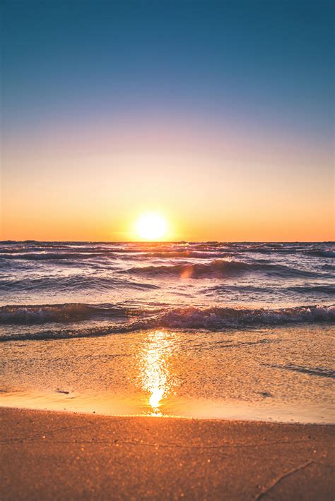 Scenic View Of Ocean During Sunset · Free Stock Photo