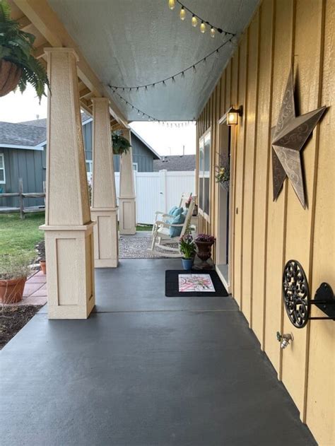 The Front Porch Is Decorated With Stars And Lights