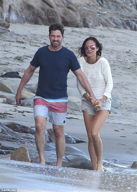 His family is of irish origin. Gerard Butler and girlfriend Morgan Brown hit Malibu beach together | Daily Mail Online