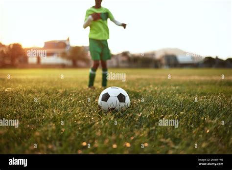 Shoot For Your Goals Closeup Shot Of A Young Boy Playing Soccer On A