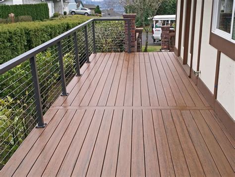 Posts, rails, and intermediate pickets are made from reinforced aluminum or wood which can stand up to the cables tension. Black Aluminum Cable Deck Railing Vancouver, WA - Traditional - Deck - Portland - by Cable ...