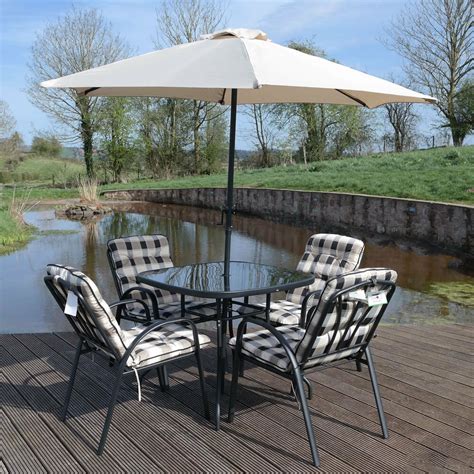 In a rainy region, resin furniture holds up well and comes in multiple designs to match any style. 4 Seater Garden Patio Furniture Set Outdoor Table Parasol ...