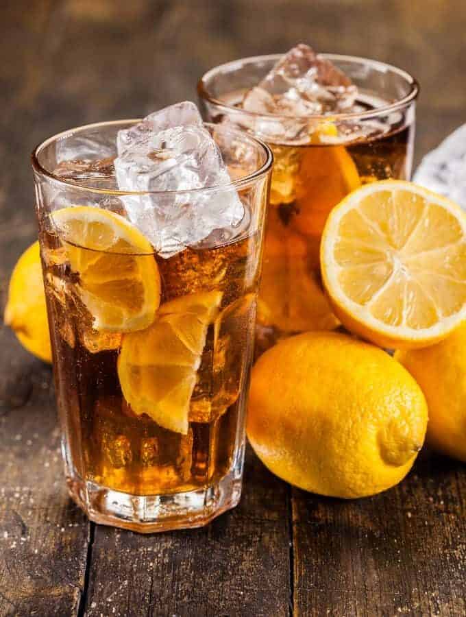 Two glasses of Iced Tea with lemons.