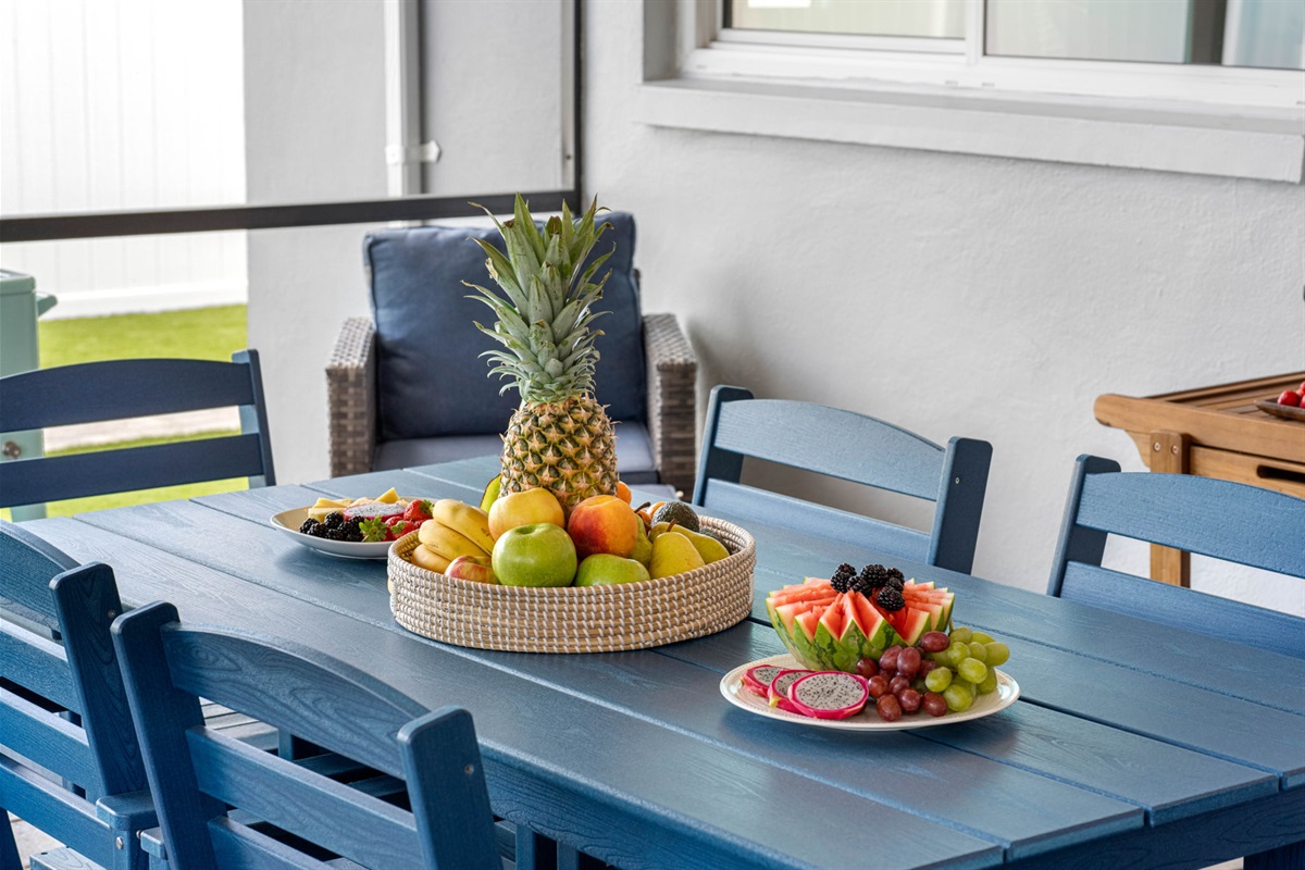 A 6-seater wooden dining table, painted in a refreshing shade of blue.