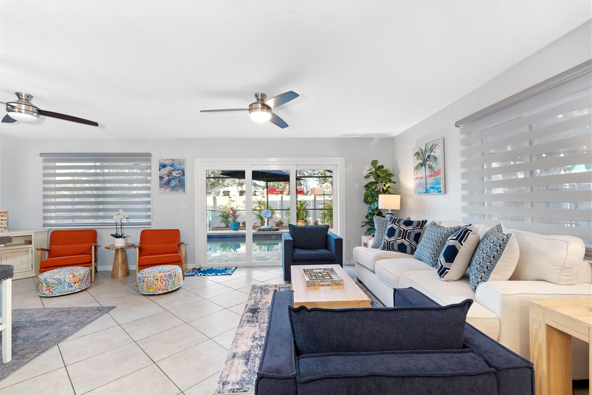 Large windows adorn the living area, allowing an abundance of natural light to flood the space.