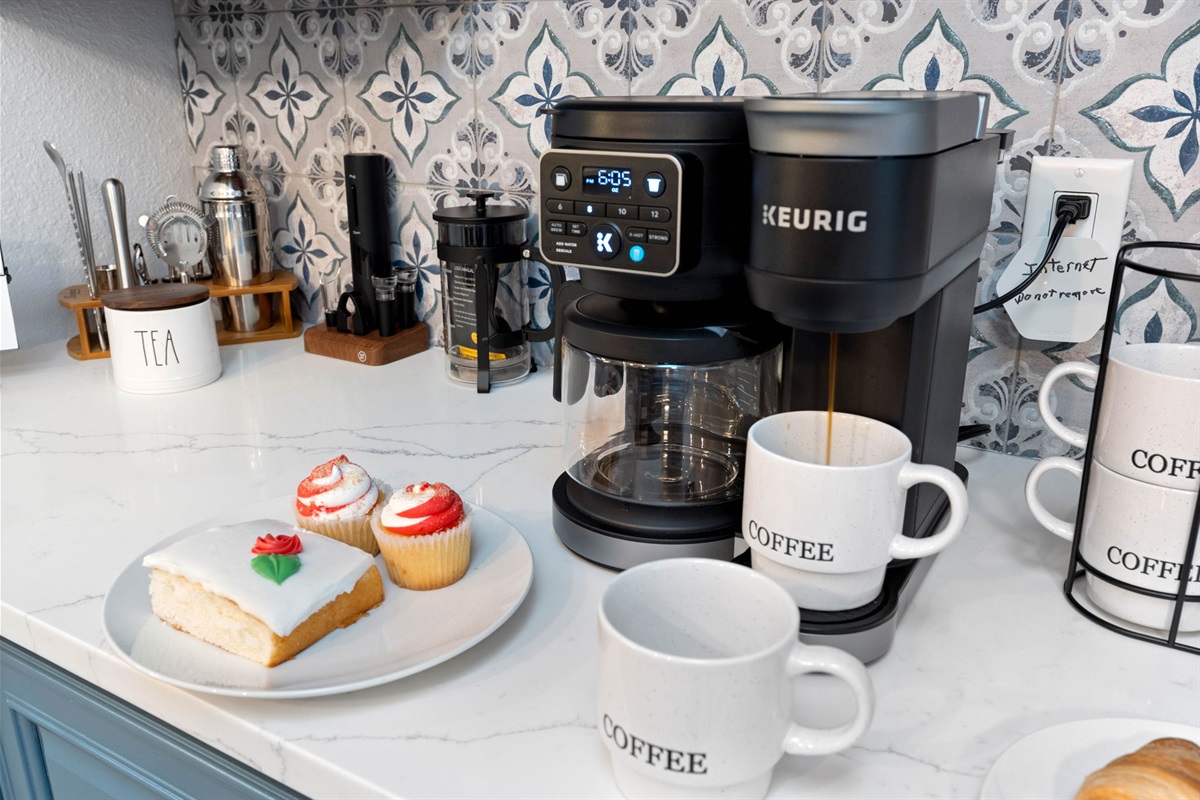 The coffee nook is a delightful retreat that combines comfort and functionality. It features a stylish coffee maker, complete with a selection of pods or ground coffee options.