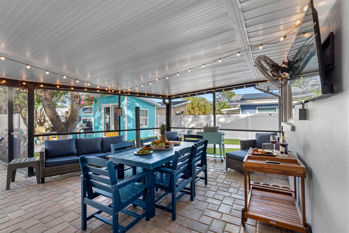 The covered patio at this property offers an inviting and versatile outdoor space perfect for both relaxation and entertaining.