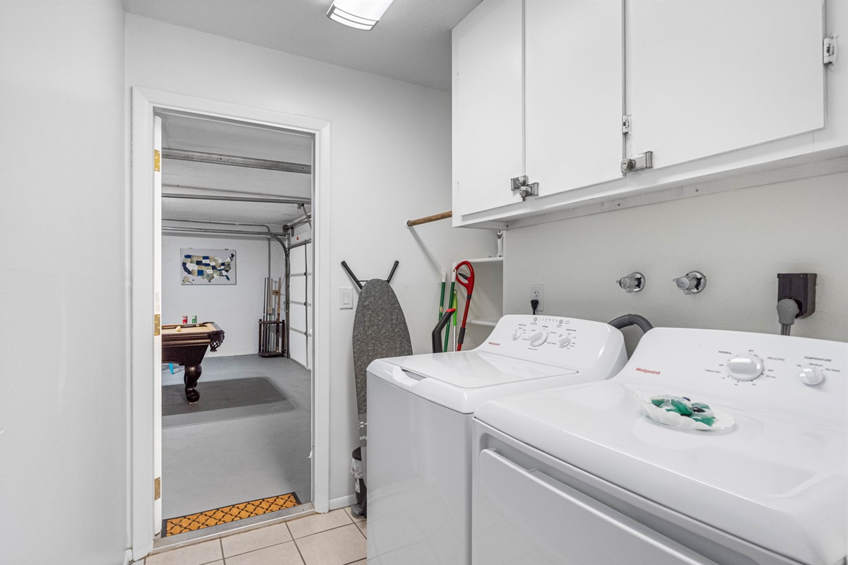 The laundry room is fully equipped to handle all your washing needs, featuring a high-quality washer and dryer for convenient in-home laundry care. 