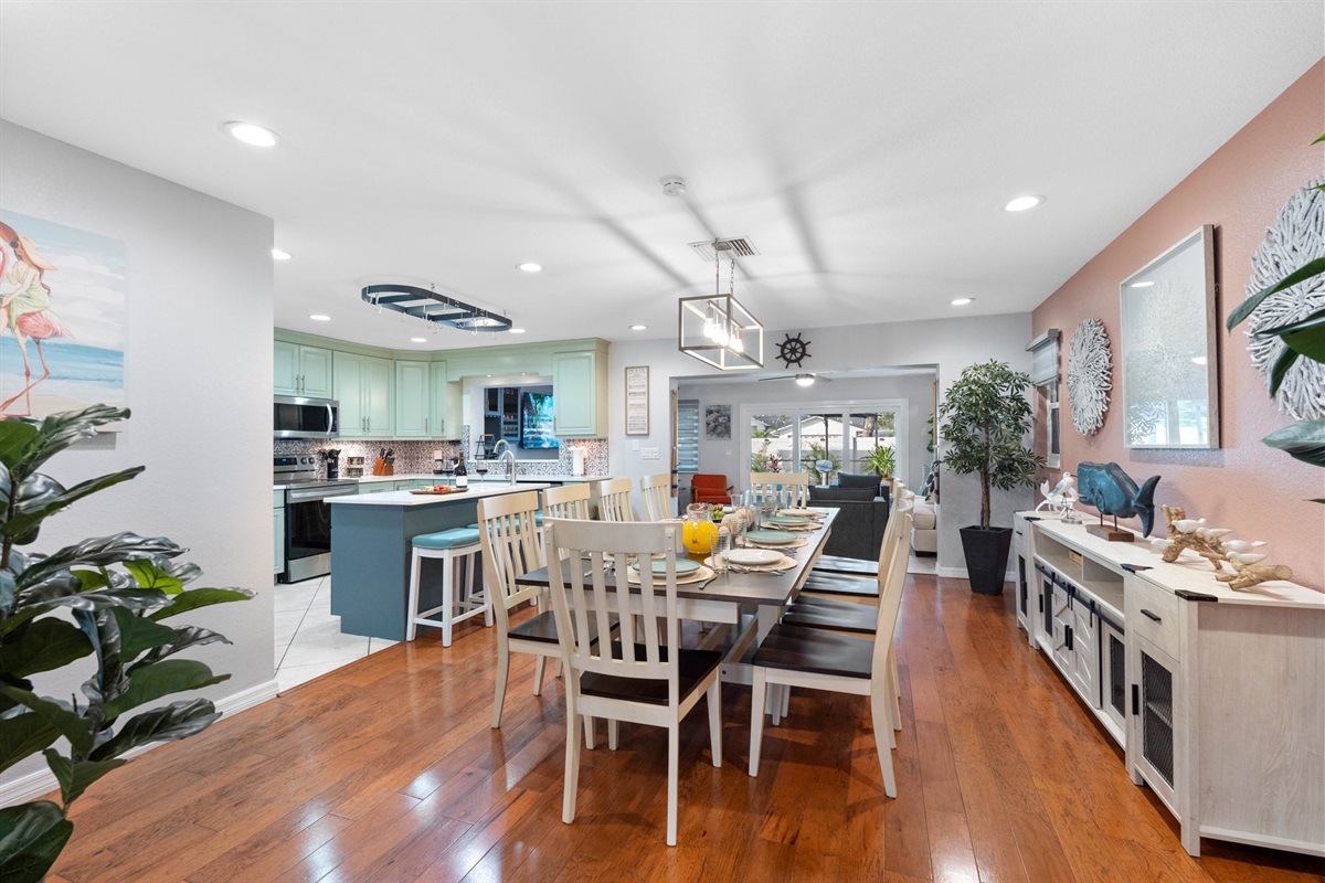 The large dining table is the focal point of this space, providing ample room for everyone to gather around.