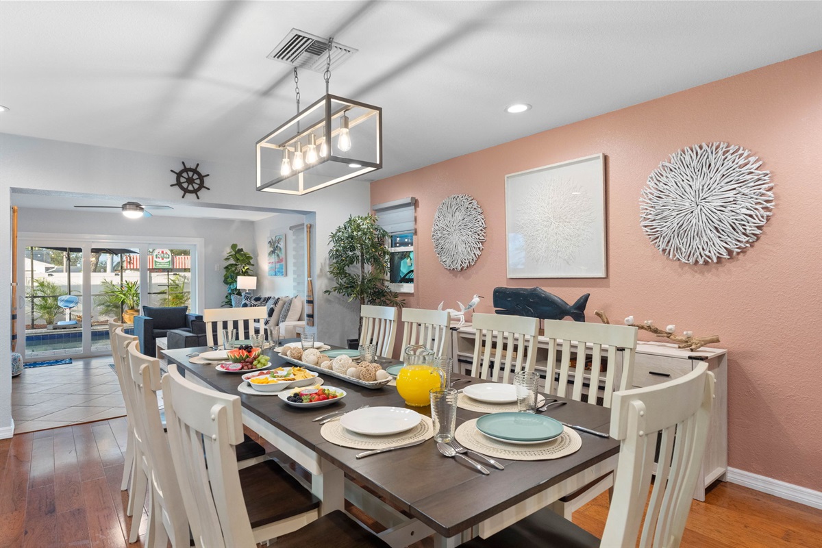 The dining area, conveniently located adjacent to the kitchen, offers a welcoming space designed for communal dining.