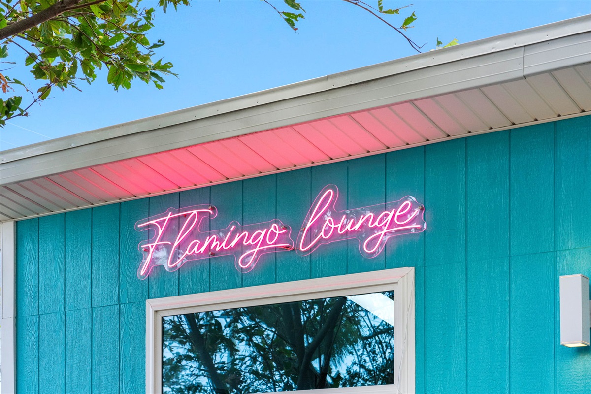 Flamingo Lounge is a beautifully designed, private living space nestled within the backyard, offering an exclusive retreat just steps away from the sparkling pool area.