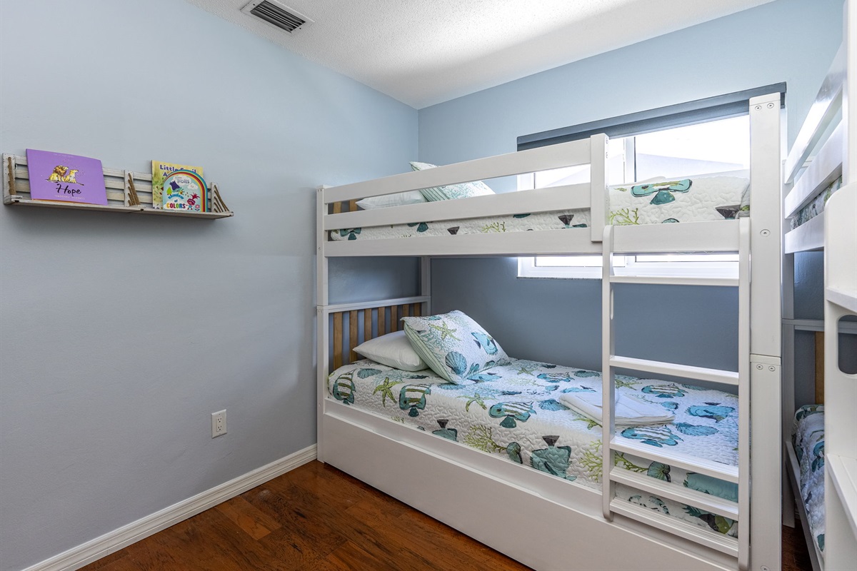 The combination of soft colors, comfortable furniture, and playful design, this bedroom offers a spacious layout making it both a cozy and practical choice for your stay.