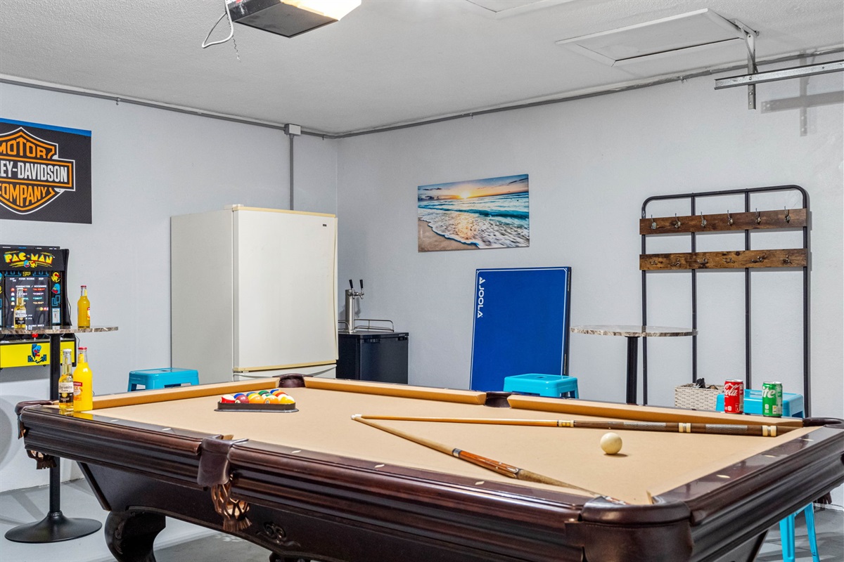 The pool table, which conveniently converts into a ping pong table, offers versatile options for both billiards and table tennis enthusiasts.