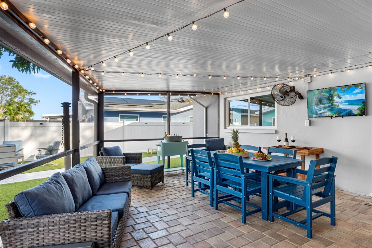 The space also features a cozy patio sofa, perfect for relaxing and unwinding while enjoying the outdoors.