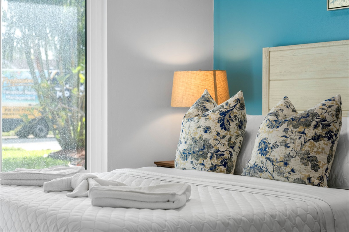 Bedroom 3, a charming queen-size bedroom that strikes the perfect balance between comfort and style.