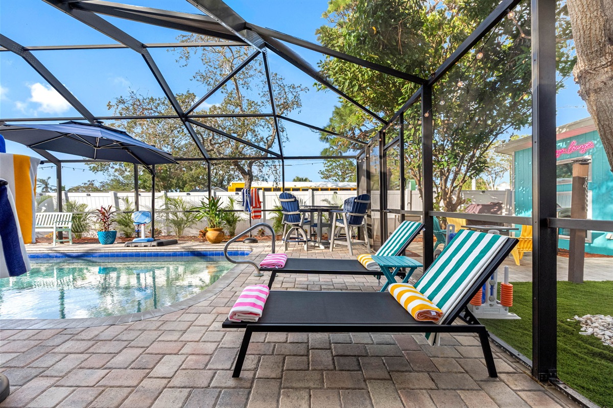 Surrounding the pool, you’ll find a selection of comfortable lounge chairs, inviting you to bask in the Florida sunshine.