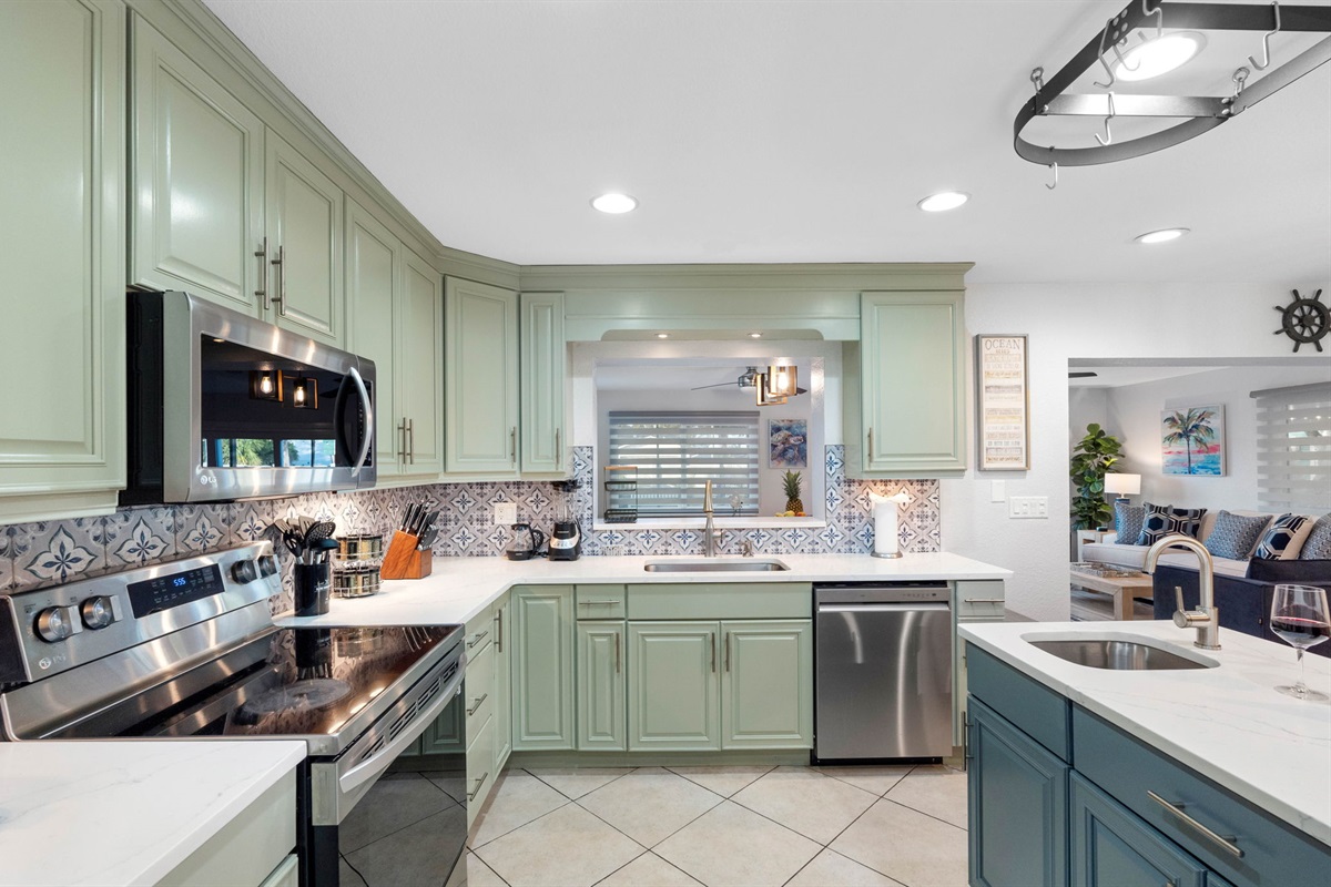 The kitchen features a full suite of modern appliances, including a sleek refrigerator, a powerful stove, an efficient oven, a convenient microwave, and a dishwasher.