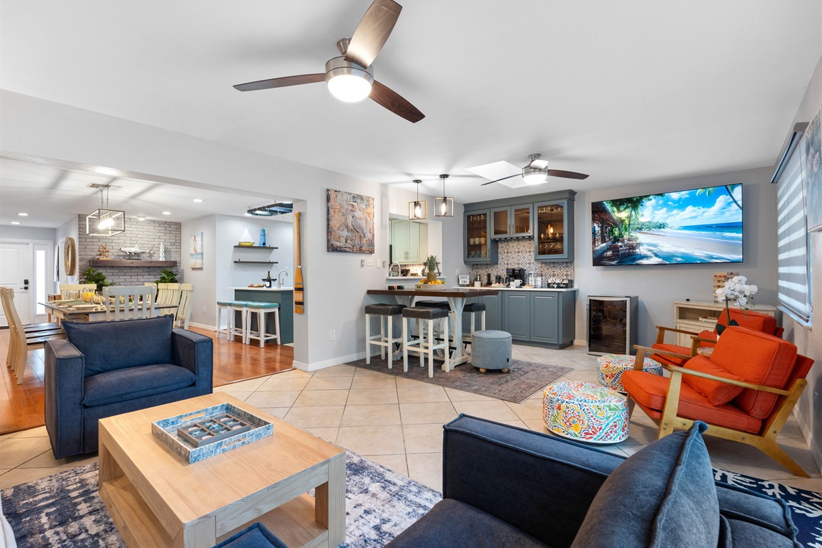 Large windows adorn the living area, allowing an abundance of natural light to flood the space.