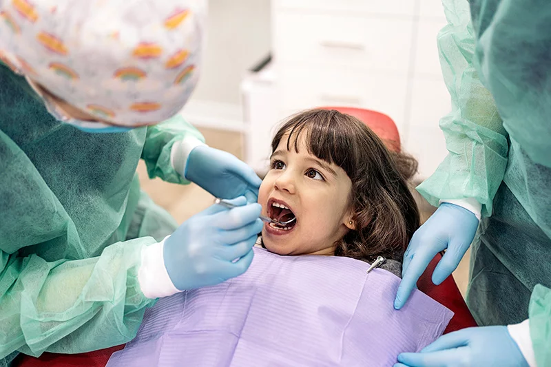 What are the facts about water in fluoride? Here a child gets a dental exam. Photo: Getty Images.