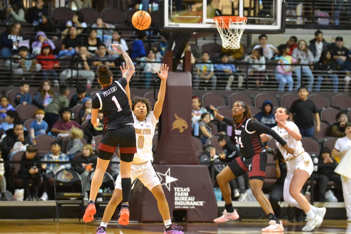 Texas State freshman guard Heather Baymon (0) attempts to block a shot during the game against Troy, Thursday, Jan. 23, 2025, at Strahan Arena.