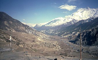 Village of Manang in the broad Manang valley of the Marshyangdi river in 1985. To the right is the Annapurna mountain range.