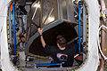 Astronauts Greg Chamitoff and Sandra Magnus move a crew quarters rack in the Harmony node.