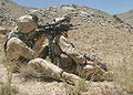 A Marine takes aim with his SAM-R in Afghanistan