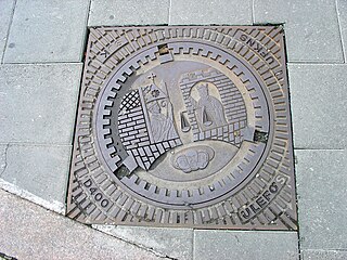 Manhole cover with the seal of the city of Trondheim