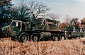 An early promotional image of a HEMTT and trailer; payload are MLRS reloads