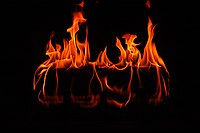 Flames flickering in a fireplace.