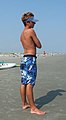 Boy wearing board shorts