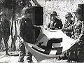 3/502nd paratroopers of the 101st Airborne Division with a captured nazi flag. Carentan, Normandy, France, June 12, 1944