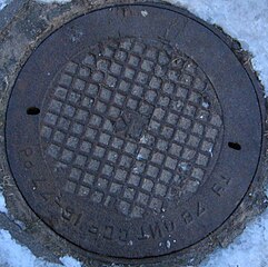 Lithuanian SSR standard manhole cover of the city sewer in Vilnius