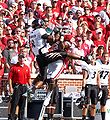 OU's Frank Broyles and Cincinnati's Brandon Underwood both go up to catch Bradford's pass