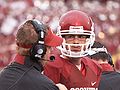 Landry Jones confers with quarterback coach Josh Heupel